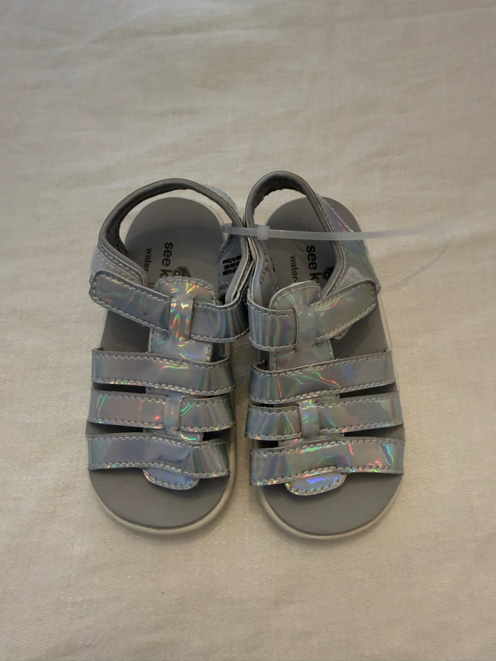See Kai Run Iridescent Holographic Sandals in Silver